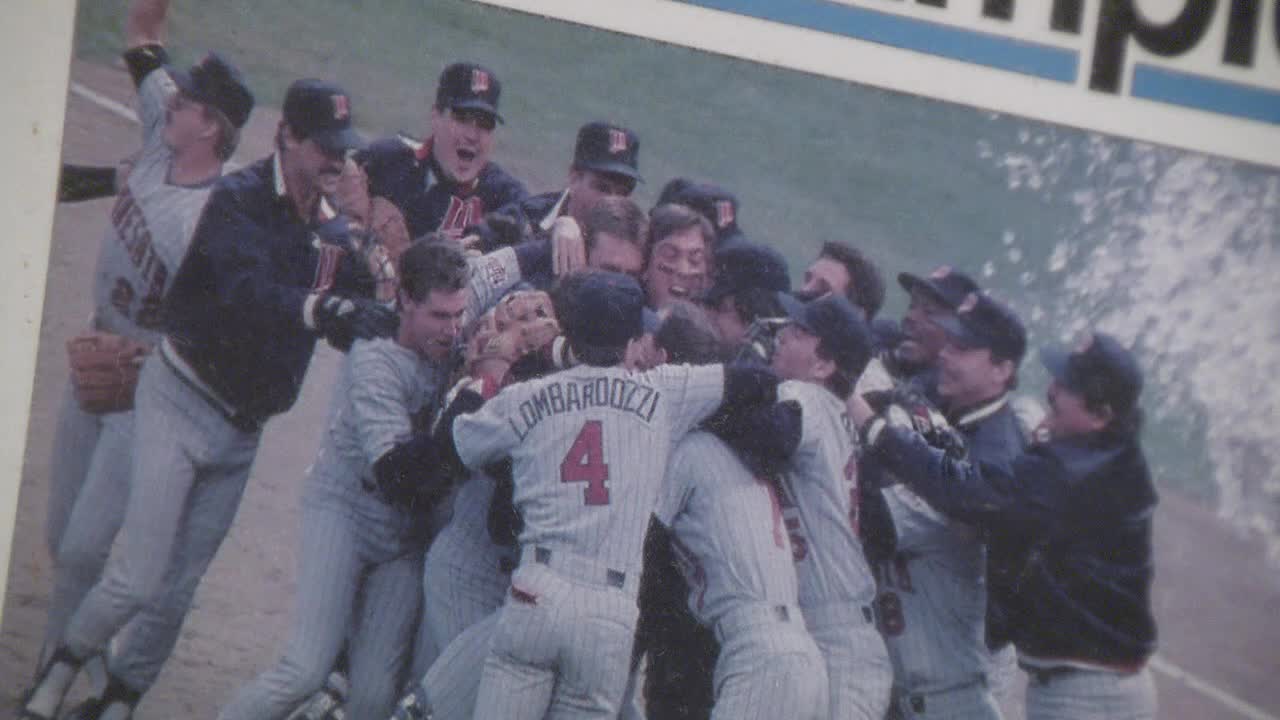 Minnesota Twins players celebrating their 1991 World Series victory on the field at the Metrodome.